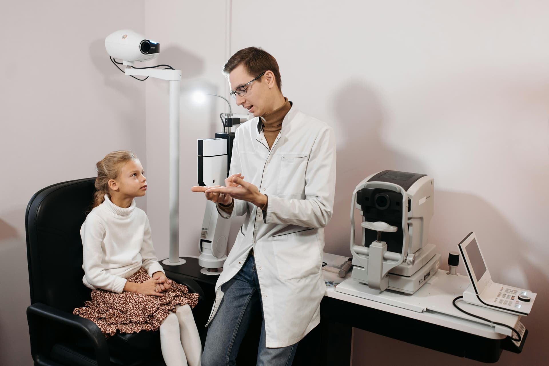 Ophthalmologist consulting with a patient in a modern eye clinic