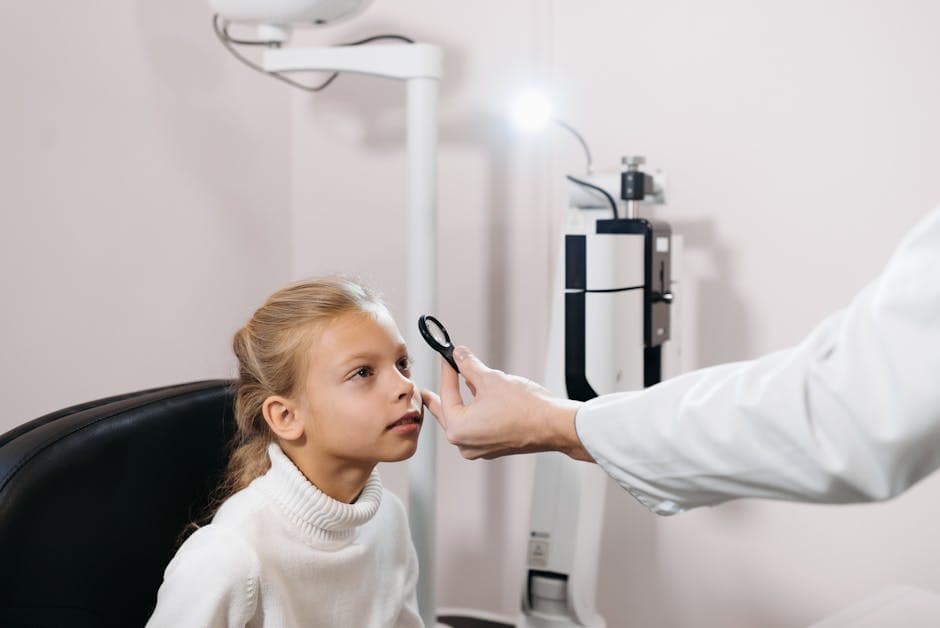 Ophthalmologist examining a young patient for keratoconus before corneal cross-linking treatment