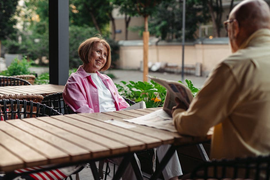 Person over 50 reading comfortably in a cafe without bifocals — freedom after lens replacement surgery